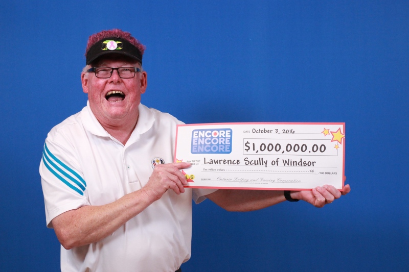 Lawrence Scully of Windsor shows off his $1-million Encore cheque. (Courtsey OLG)