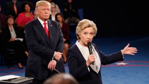 Democratic presidential nominee Hillary Clinton speaks as Republican presidential nominee Donald Trump listens during the second presidential debate at Washington University in St. Louis, Sunday, Oct. 9, 2016. (Rick T. Wilking/Pool via AP) 