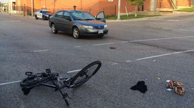 Car and cyclist collide at Victoria and Duke