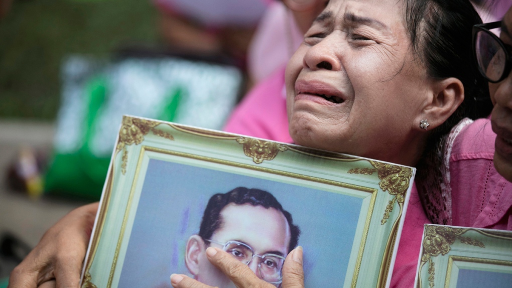 A Thai woman cries as she prays in Bangkok