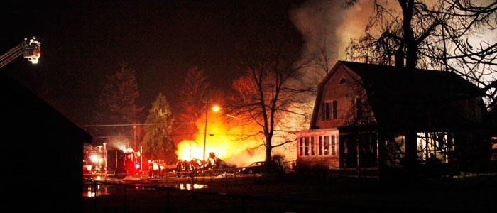 A plane burns after it crashed into a house in Clarence Center, N.Y., Thursday, Feb. 12, 2009.  (AP / David Duprey)