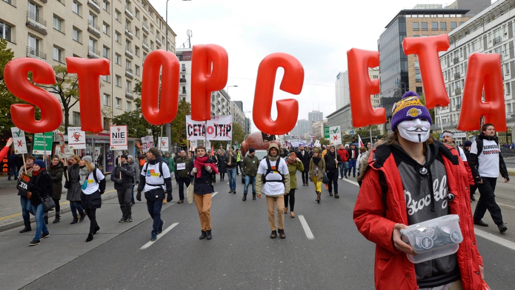Anti-CETA protesters march in Warsaw, Poland