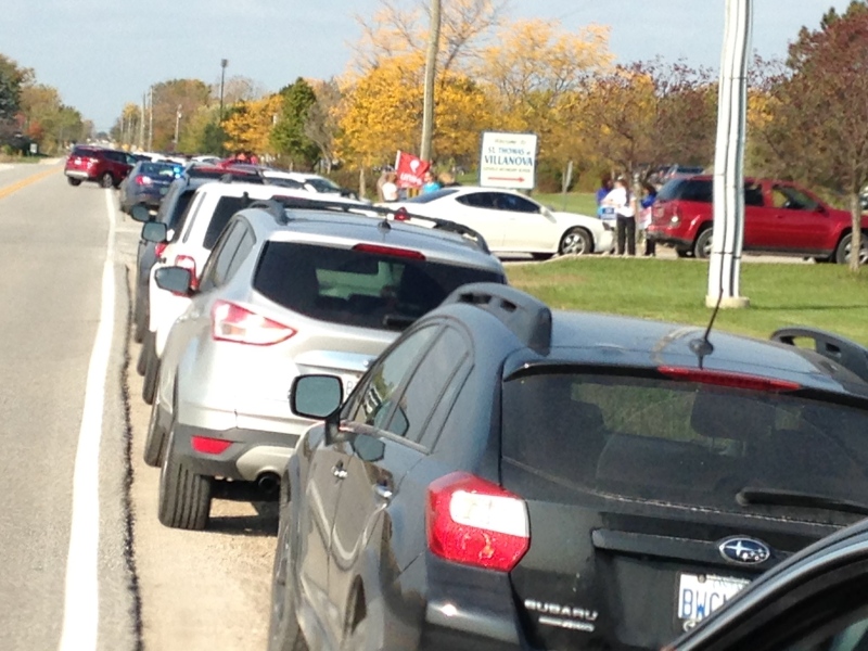 Long line of teachers waiting to get into St.Thomas of Villanova as picket line continues and student leave for home in LaSalle, Ont., on Tues., Oct. 18, 2016. (chris Campbell / CTV Windsor) 