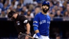Toronto Blue Jays' Jose Bautista walks back to the dugout after striking out against the Cleveland Indians during third inning, game four American League Championship Series baseball action in Toronto on Tuesday, Oct. 18, 2016. (Nathan Denette/AP)
