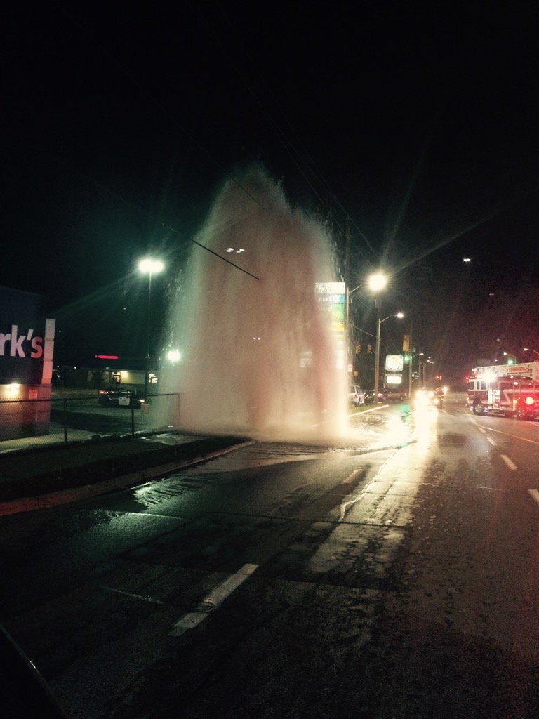 A vehicle hit a fire hydrant causing it to gush water on Erie Street South in Leamington, Ont. (Leamington Fire/Twitter)