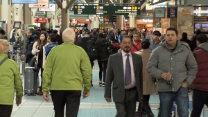 Passengers walk through Vancouver International Airport during the busy holiday season. 