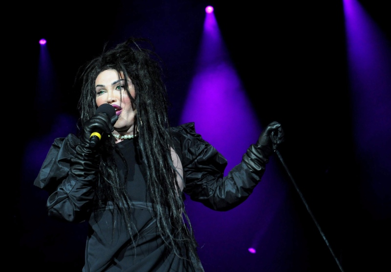 In this file photo dated Dec. 21, 2012, showing singer of the band Dead or Alive, Pete Burns in concert in London. Burns died on Sunday Oct. 23, 2016, after suffering a cardiac arrest, according to a statement from his management. (Ian West / PA FILE via AP)