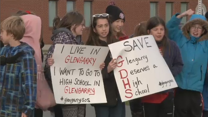 Students of the Glengarry District High School holds signs while staging a walk-out on Tuesday, Oct. 25, 2016 to protest the proposed closure of their school. (Jeff Dorn/CTV Ottawa)