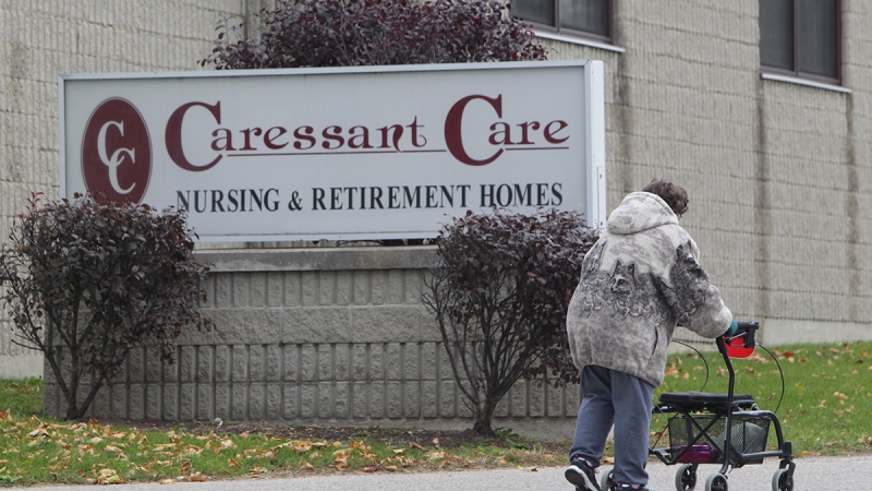 A woman walks into the Caressant Care facility in Woodstock, Ont. on Tuesday, Oct. 25, 2016. (Dave Chidley / THE CANADIAN PRESS)