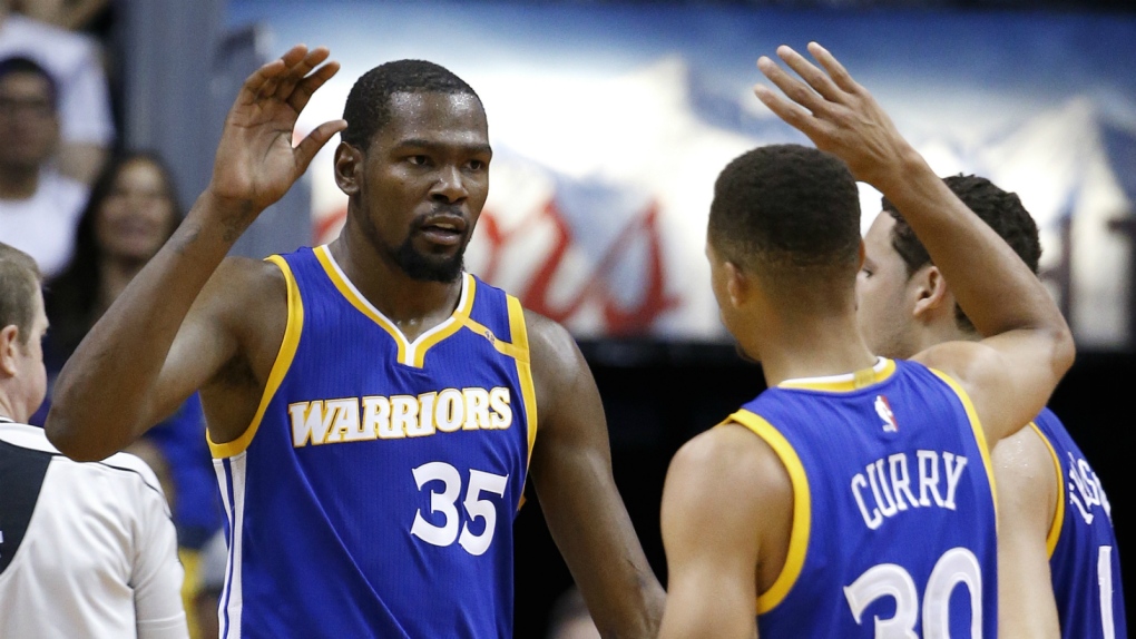 Durant and Curry celebrate against Suns