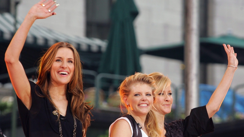 In this May 26, 2006, file photo, Dixie Chicks, from left, Emily Robison, Natalie Maines and Martie Maguire, wave to the crowd as they perform on ABC's "Good Morning America" summer concert series in Bryant Park, in New York. (AP Photo / Dima Gavrysh, File)