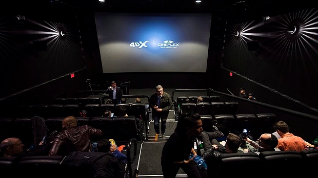 People mill about inside a Cineplex theatre as it opens its first 4DX sensory experience theatre which features 80 motion seats and other enhancements like water effects, snow, wind, lighting and scent in Toronto on Friday, November 4, 2016. The auditorium at Cineplex Cinemas Yonge-Dundas and VIP is the 300th 4DX screen and the first in Canada. (THE CANADIAN PRESS/Nathan Denette)