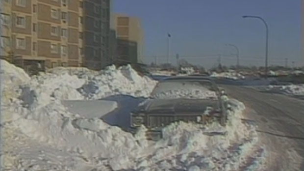 This still from a CKY News report on the 1986 blizzard shows a car buried in heavy snow. About 35 cm fell between Nov. 7 and 8 of that year. (File Image)