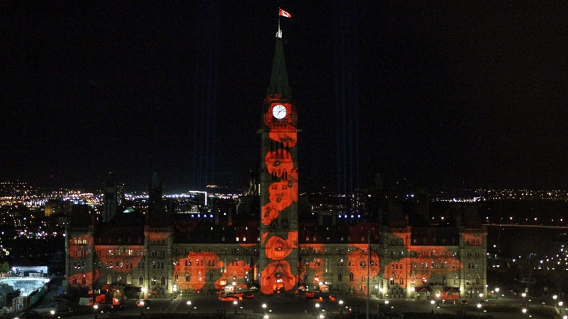 The "virtual poppy drop" digital light show features 117,000 poppies projected onto the Centre Block of Parliament. (Dario Balca / CTV News)