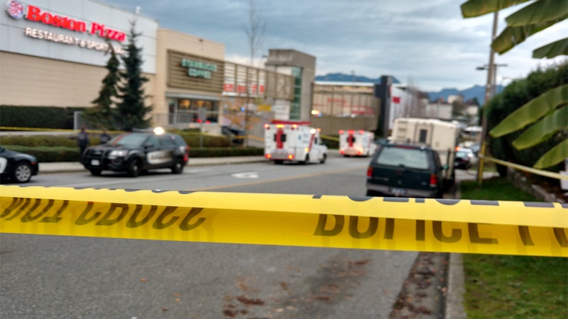 Police tape blocks the scene of a double-stabbing and hostage taking at a Canadian Tire in East Vancouver. Nov. 10, 2016. (CTV/Ben Miljure) 