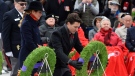 Prime Minister Justin Trudeau lays a wreath as Sophie Gregoire Trudeau looks on as they take part in the National Remembrance Day Ceremony at the National War Memorial in Ottawa on Friday Nov. 11, 2016. (THE CANADIAN PRESS/Adrian Wyld)