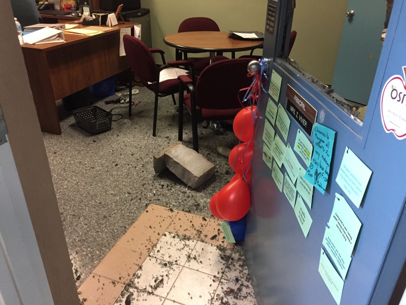 A bench was used to smash the door at St. Gabriel school in Windsor, Ont. (Courtesy WECDSB)