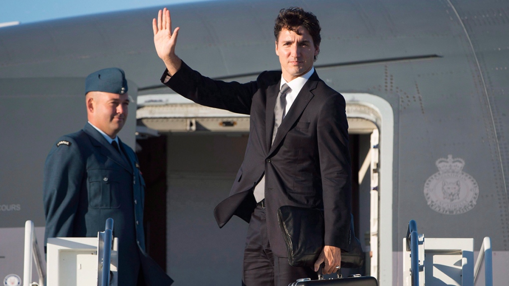 Prime Minister Justin Trudeau boards a plane