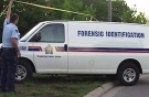 Police investigate the discovery of a dead baby near Parkside Drive in Brantford in this file image from video taken in July 2005.