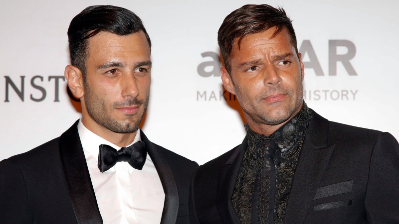 Singer Ricky Martin, right, and artist Jwan Yosef pose on the red carpet of The Foundation for AIDS Research (amfAR) event in Sao Paulo, Brazil, Friday, April 15, 2016. (AP Photo / Andre Penner)