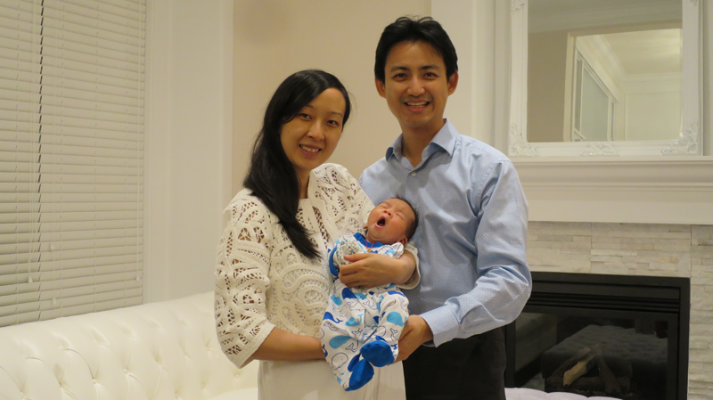 Florence Leung, her husband Kim Chen and their newborn baby are seen in a photo provided to CTV News by a family friend. 