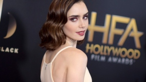 FILE - In this Sunday, Nov. 6, 2016 file photo, Lily Collins arrives at the 20th annual Hollywood Film Awards at the Beverly Hilton Hotel in Beverly Hills, Calif. (Photo by Richard Shotwell/Invision/AP, File)