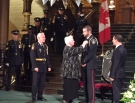 Lieutenant Governor of Ontario Elizabeth Dowdeswell gives a medal of bravery to Const. Fraser Curtis at a ceremony at Queen’s Park on Thursday, Nov. 25, 2016. (Courtesy Chatham-Kent police)