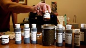 Various uses for cannabis oil are sold to customers at the Cannabis Buyers Club, in Victoria B.C., Thursday June 11, 2015. (THE CANADIAN PRESS / Chad Hipolito)