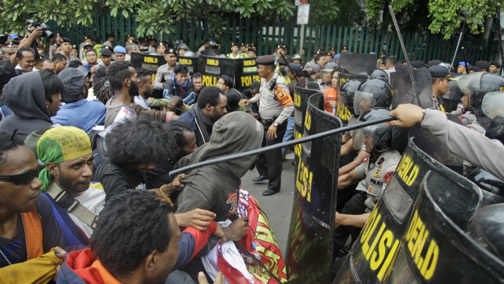 Protesters scuffle with police in Jakarta