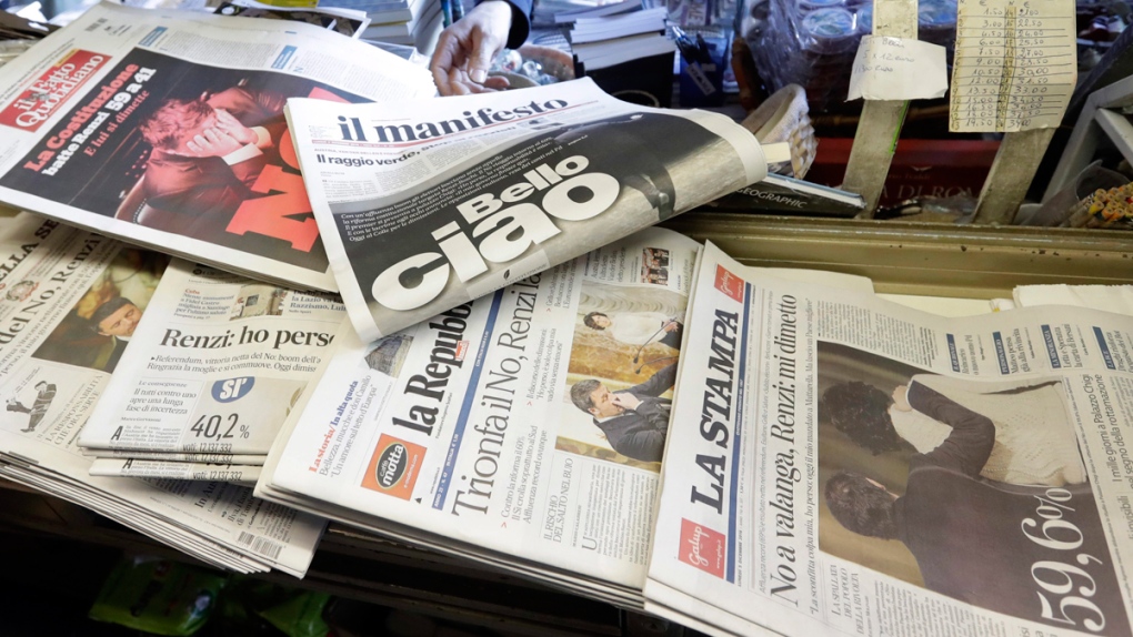Newspaper headlines at a newsstand in Rome