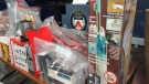 A raft of counterfeit goods are displayed at Toronto Police HQ on Dec. 9. (Arda Zakarian/CP24)