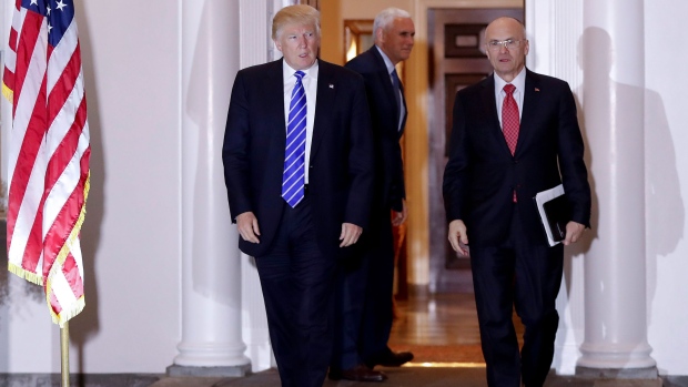 Donald Trump with CKE Restaurants CEO Andy Puzder