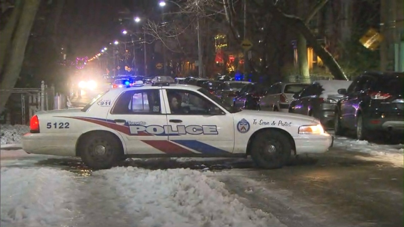 Police at the scene of a violent carjacking in Cabbagetown on Dec 13, 2016.