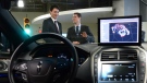 Blackberry QNX Director of Engineering Sheridan Ethier speaks to Prime Minister Justin Trudeau as he visits the Blackberry QNX facility in Ottawa on Monday, Dec 19, 2016. THE CANADIAN PRESS/Sean Kilpatrick