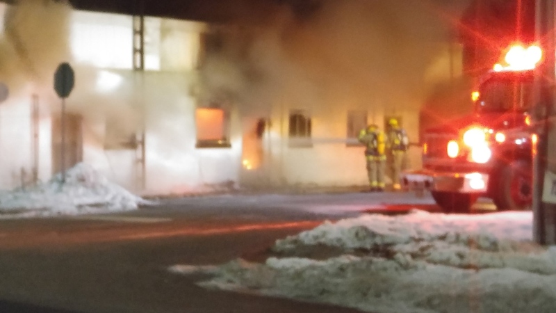 Firefighters at the scene of a blaze at a Main Street apartment building in Comber, Ont. on Friday, Dec. 23, 2016.
(Twitter / John Mahon)