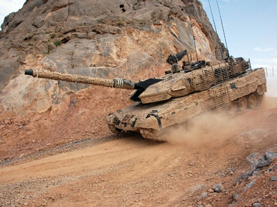 A Canadian Leopard A6M battle tank navigates a rocky mountain pass in the Panjwaii district of Afghanistan on Wednesday, Feb. 25, 2009. (THE CANADIAN PRESS / Murray Brewster)