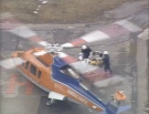 Paramedics move one of the Ajax victims into an air ambulance for transport to hospital on Friday, Feb. 27, 2009.