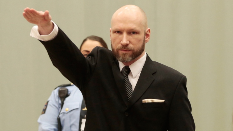 Anders Behring Breivik raises his right hand at the start of his appeal case in Borgarting Court of Appeal at Telemark prison in Skien, Norway, on Jan. 10, 2017. (Lise Aaserud / NTB Scanpix)