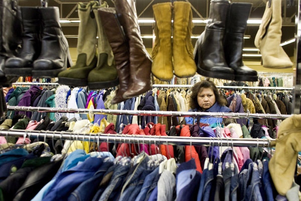 A shopper browses racks of clothes at Value Village in Toronto on Tuesday, Dec. 30, 2008. (Jim Ross / THE CANADIAN PRESS)