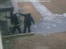 Two suspects are seen shooting a pair of guns in this surveillance video footage.