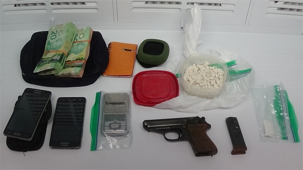 Drugs, cash, and a handgun police say were seized