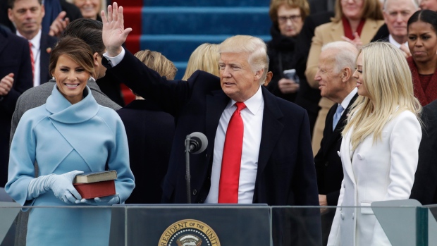 U.S. President Trump waves after swearing oath