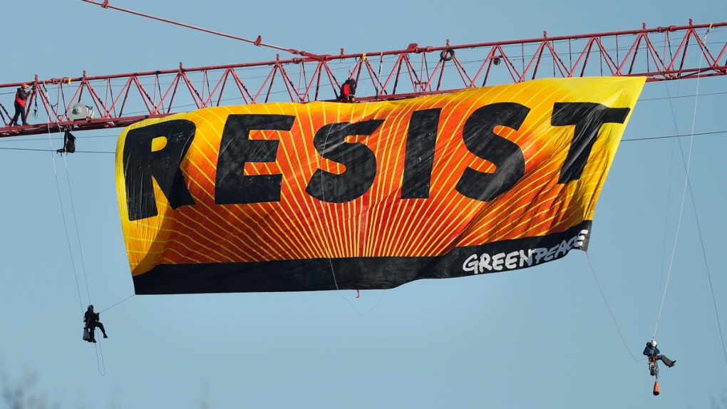 Protesters unfurl a 'Resist' banner in D.C.
