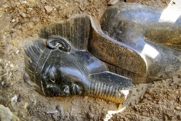 This undated photo released by Egypt's Supreme Council of Antiquities on Thursday, March 5, 2009, shows a statue of ancient pharaoh Amenhotep III which was found by an excavation team clearing out a temple dedicated to the pharaoh, on the west bank of the Nile in the southern city of Luxor, in Egypt. (AP / Supreme Council of Antiquities)
