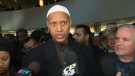 Imam Said Rageah speaks with reporters at city hall on Wednesday.