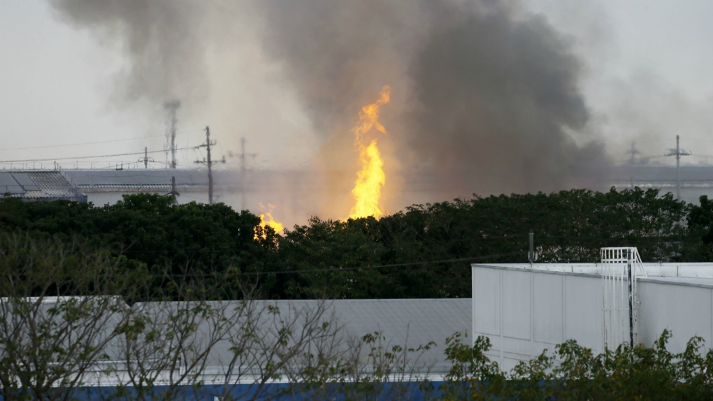 Flames are seen from a factory fire in Philippines