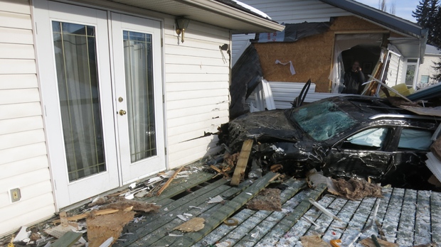 Olds - SUV crashes into houses
