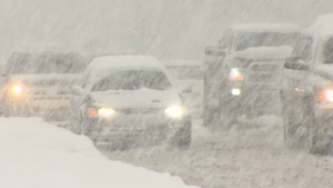 A file photo shows cars on a snowy road in the Fraser Valley.