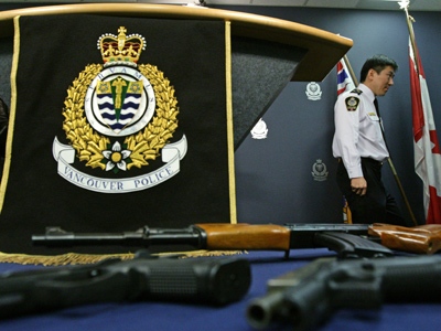 Vancouver Police Chief Jim Chu departs a news conference after announcing several gang related arrests as some of the weapons seized as part of the busts are displayed in Vancouver, B.C., on Friday, March 6, 2009. (THE CANADIAN PRESS / Darryl Dyck)