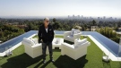 In this Thursday, Jan. 26, 2017, photo, developer Bruce Makowsky poses for a photo on the balcony off the master bedroom of a $250 million mansion he built in the Bel-Air area of Los Angeles. (AP / Jae C. Hong)
